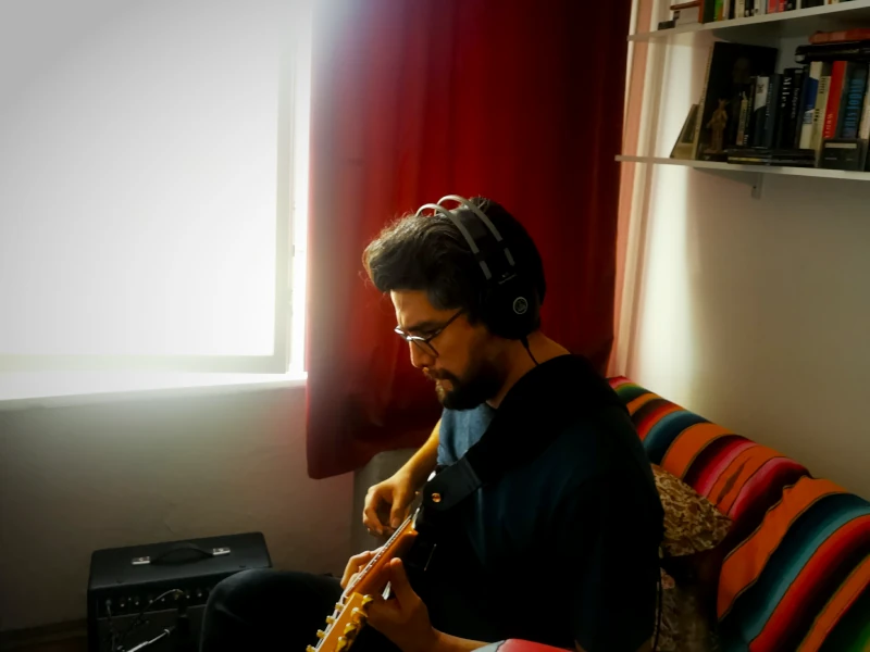 Eric Trejo recording electric guitar from the control room at Hot Milk Studio Berlin.